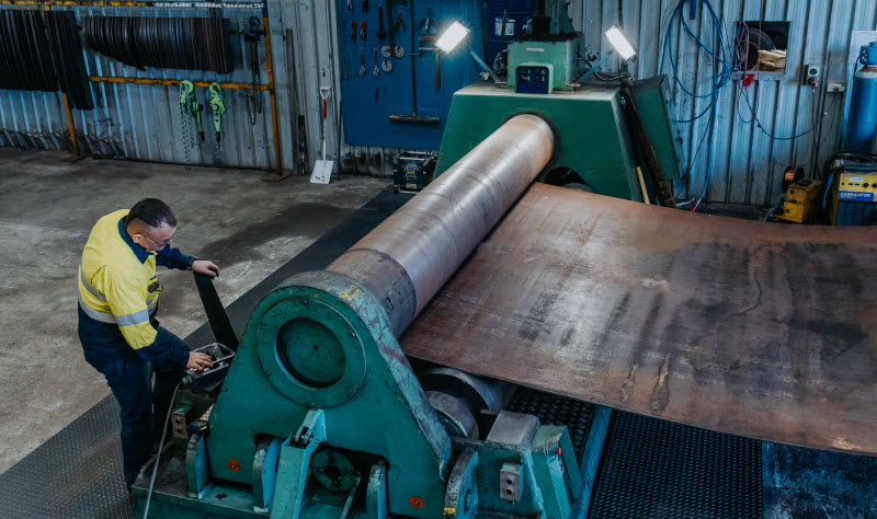 Man using a machine for a steel plate